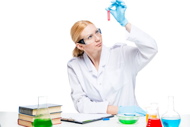 istock Specialist chemist biologist with test tubes at the table makes experiments 863265148