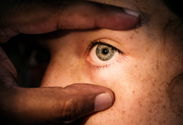 Directly below woman's hand reaching for something in a brown paper bag. Part of a series.
