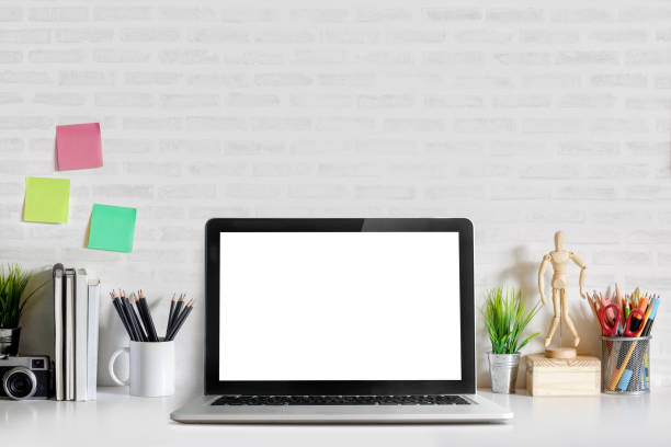 istock Mockup copy space blank screen laptop and office supplies on white desk. Stylish workspace concept. 863315178
