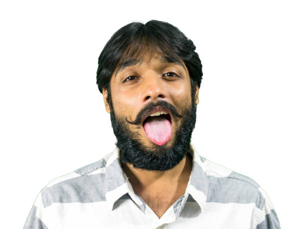 istock Bizzare hipster sticking tounge out. 863317712