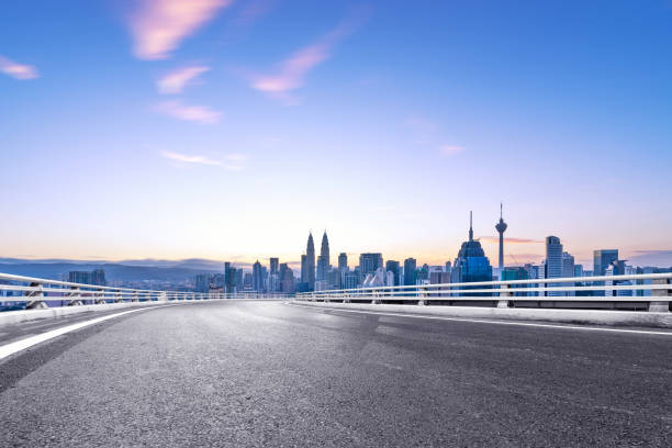 istock empty asphalt road with cityscape of modern city 863317780