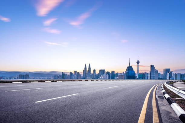 istock empty asphalt road with cityscape of modern city 863320424