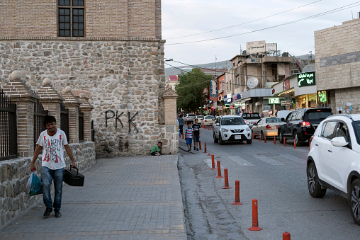 Sulaymaniyah, Iraq - May 9, 2017: The letters PKK are painted on the wall of a building in Sulaymaniyah, a Kurdish city in northern Iraq. PKK stands for Partiya Karkeren Kurdistan (in English, Kurdistan Workers' Party), and is considered a terrorists organization by Turkey, where conflict with the group has claimed thousands of lives since the 1980s.