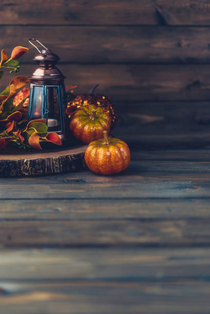 istock Fall still life with lantern and pumpkins 863324188