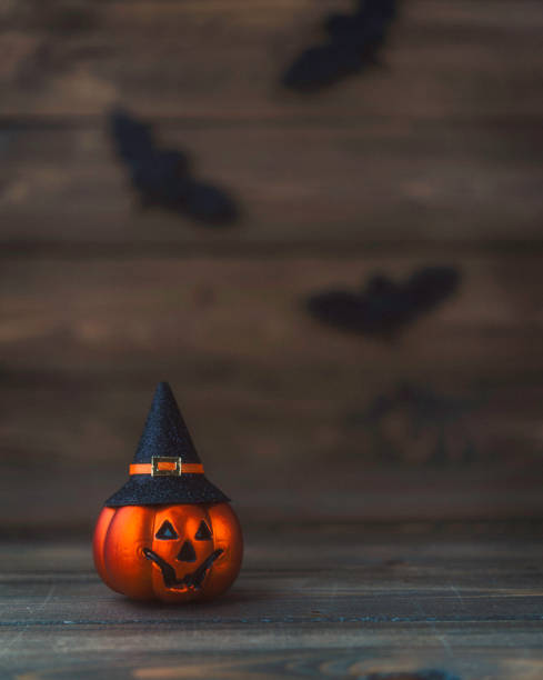 istock Little pumpkin witch with bats for Halloween 863326478