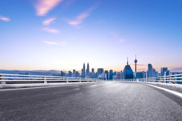 istock empty asphalt road with cityscape of modern city 863326994
