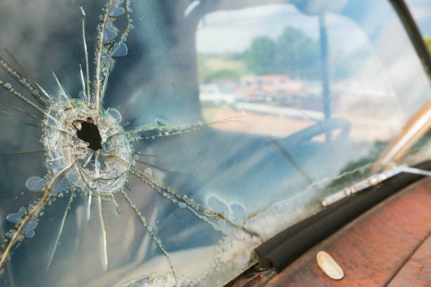 istock Windshield Of Junkyard Vehicle Has Hole And Cracks In Glass 863329274