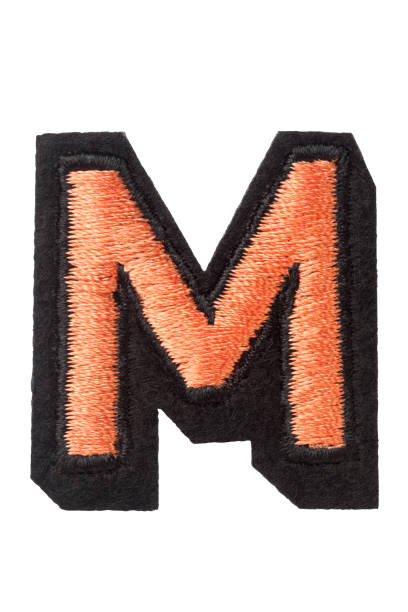 istock Capitol letter M of stitched with thread 863331568