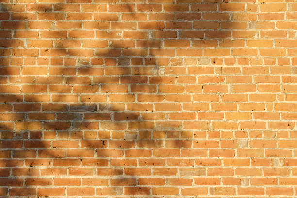 istock Very Old Worn Patched Clay Brick Wall Background 863331684