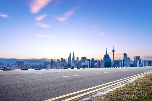 istock empty asphalt road with cityscape of modern city 863331742