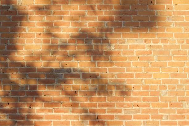 istock Very Old Worn Patched Clay Brick Wall Background 863334026