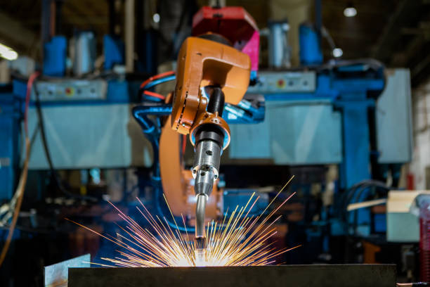 robot is welding assembly automotive part in car factory - soldar imagens e fotografias de stock