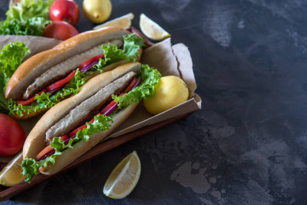 istock Mackerel in baguette with red onion tomato and salad. Copy space 863345154