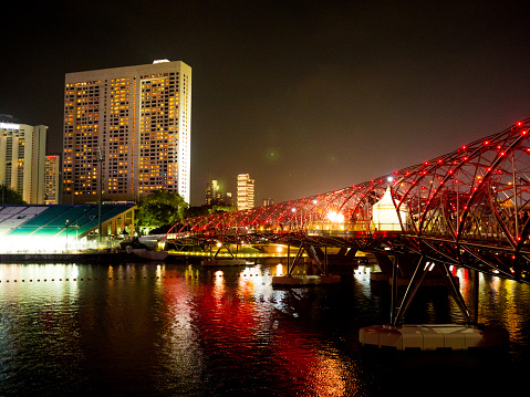 Helix bridge at night time in Singapore.