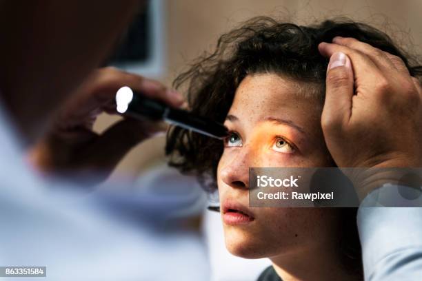 Young Caucasian Girl Getting An Eye Examination Stock Photo - Download Image Now - Eye, Patient, Doctor