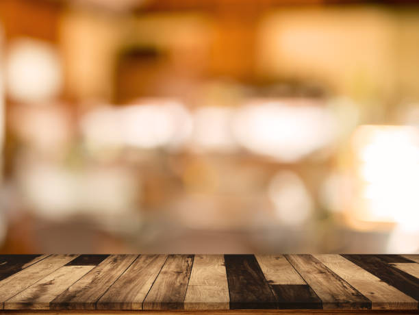 istock wood table with blurred interior in cafe background 863361258
