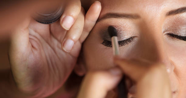 Beautiful girl applying make-up for her wedding by make-up artist Young adult woman, Wedding preparation, Make-up application, Beauty make-up. ceremonial make up stock pictures, royalty-free photos & images