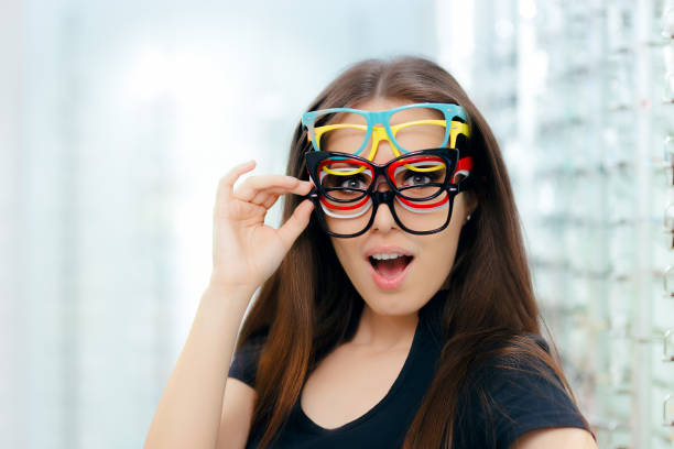 Funny Woman Trying Many Eyeglasses Frames in Optical Store