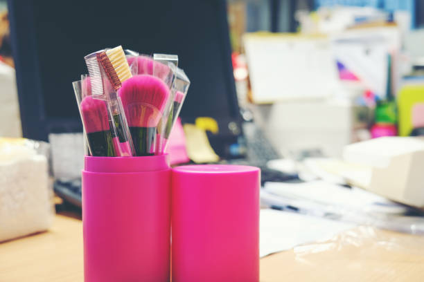 istock New cosmetics brush on make up set put on table in office, woman office will make up after work .computer background, copy space, 863379998