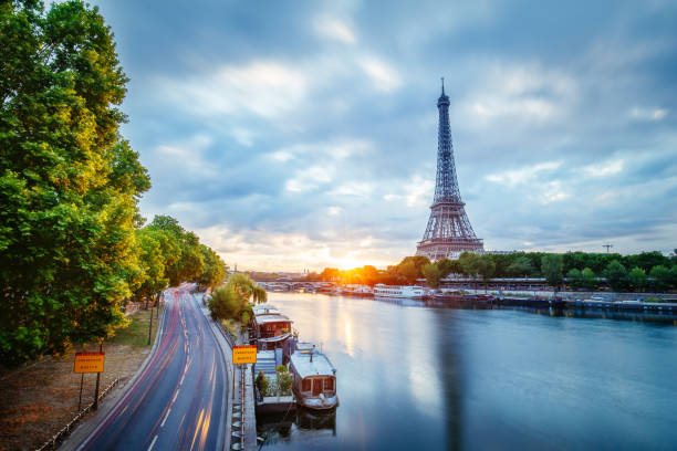 istock Amazing view over the Eiffel Tower from a bridge at sunrise with Seine river and bridge. 863382922