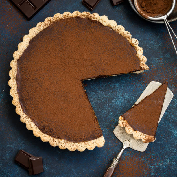 istock chocolate and caramel tart on dark blue background 863383514