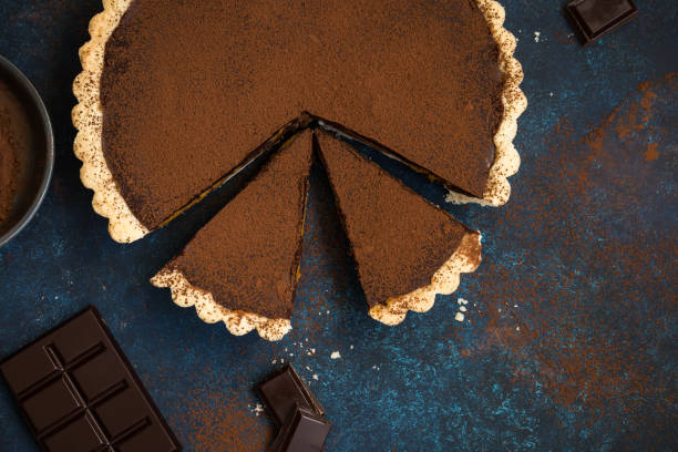 istock chocolate and caramel tart on dark blue background 863383520