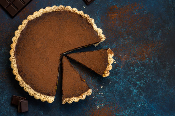 istock chocolate and caramel tart on dark blue background 863383522