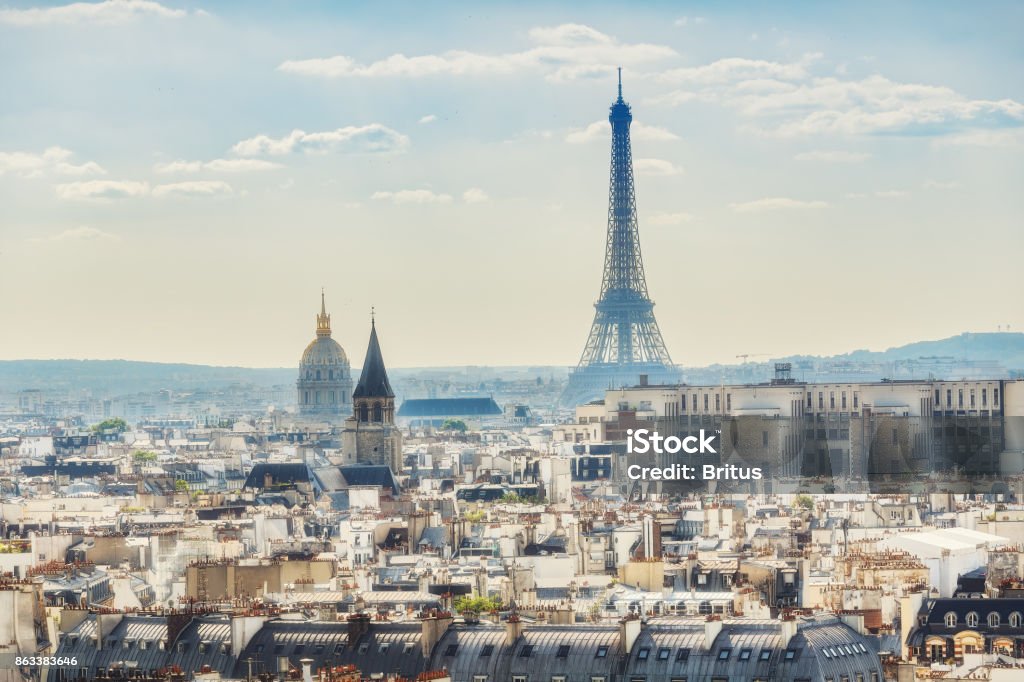 Scenic rooftop view of Paris, France, from Notre Dame Cathedral with the Eiffel Tower Scenic rooftop view of Paris, France, from Notre Dame Cathedral with the Eiffel Tower in the background. Colourful summer skyline. Popular travel destination. Paris - France Stock Photo