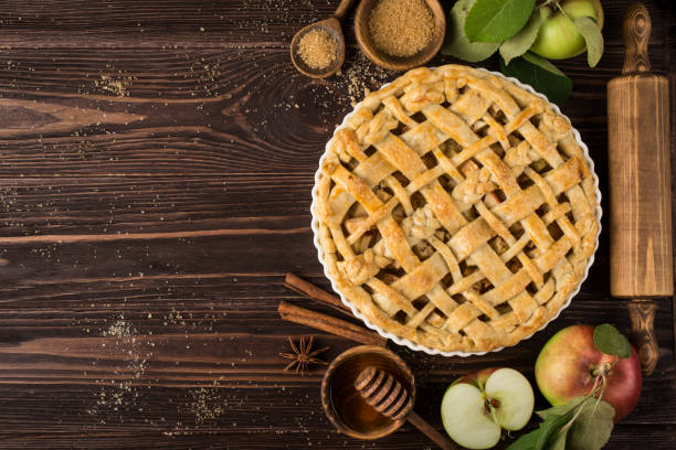 istock apple pies and ingredients on wooden background.  Top view 863383650