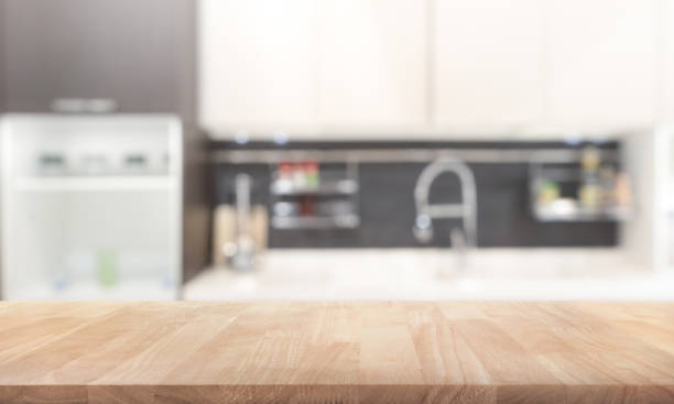 istock Wood table top on blur kitchen wall room background 863399664