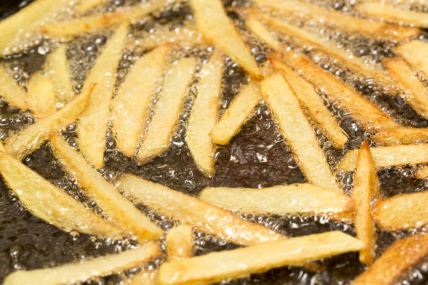 istock French fries fried in a pan 863401240