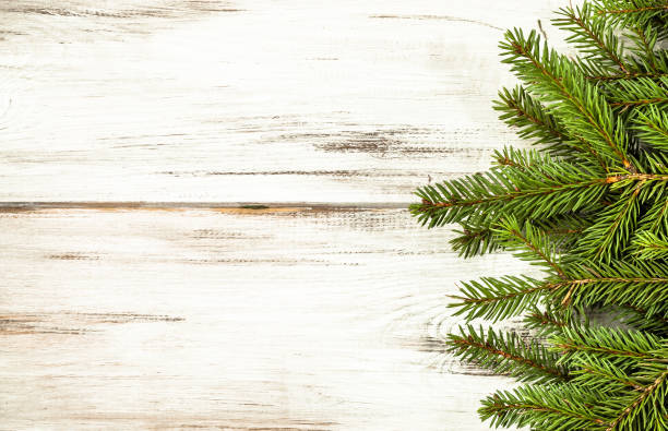 istock Christmas frame with fir branches on wooden rustic background, copy space 863411886