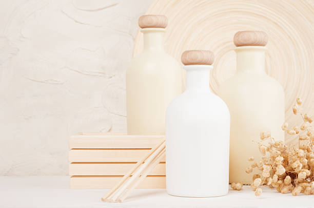 istock Blank white, beige cosmetics bottles with spikelets on white wood board, copy space, mock up. 863431518