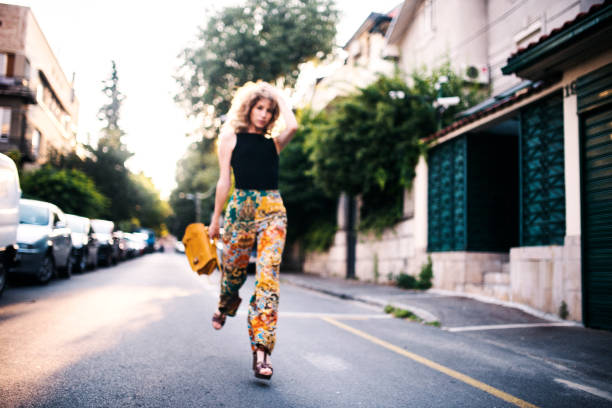 istock Stylish young woman running 863433732