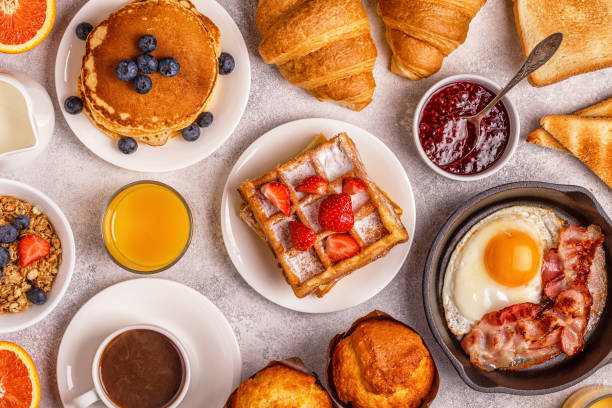 delicious breakfast on a light table. - waffle imagens e fotografias de stock