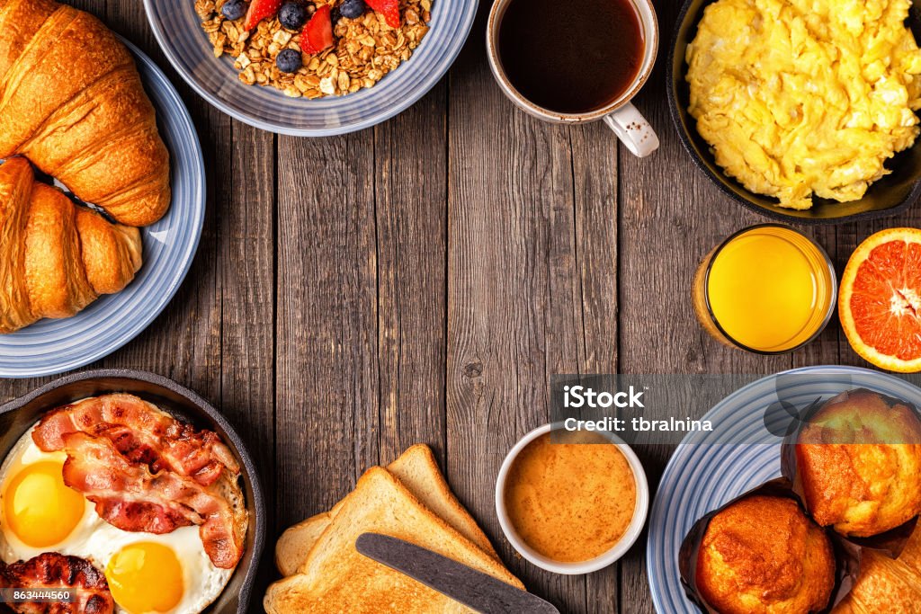 Delicious breakfast on a rustic table. Delicious breakfast on a rustic table. Top view, copy space. Breakfast Stock Photo