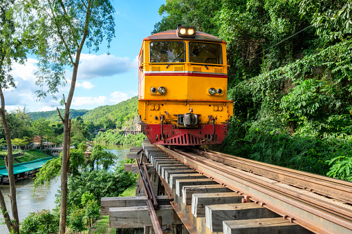 Ancient train running on wooden railway in Tham Krasae, Kanchanaburi, Thailand