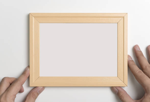 istock Hands holding Blank wooden photo frame for mock up 863450118