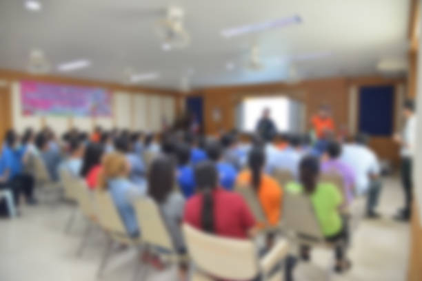 istock blurred group of  people meeting room. 863450238