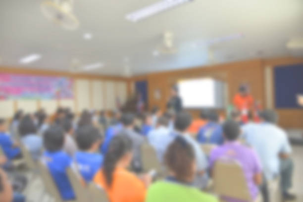 istock blurred group of  people meeting room. 863450734