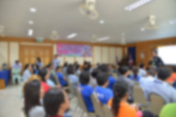 istock blurred group of  people meeting room. 863450742