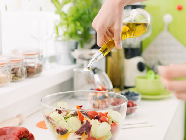 istock Woman preparing a fresh healthy salad 863454500