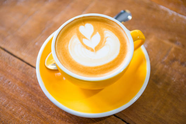 istock Coffee cups with latte art in cafe 863455774