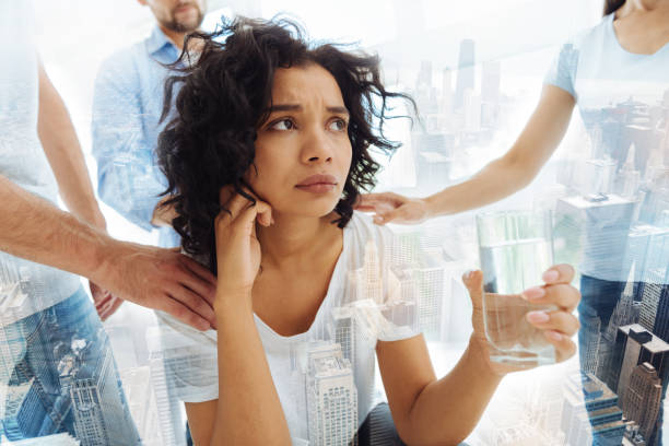 istock Sad young woman attending psychologist 863467442