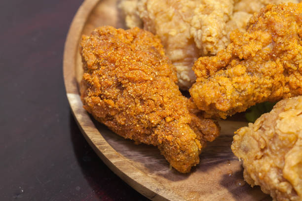 fried chickens on wooden plate