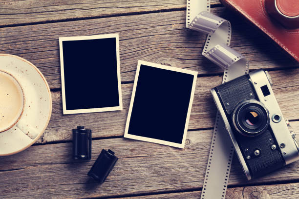 istock Vintage camera and blank photo frames 863472850
