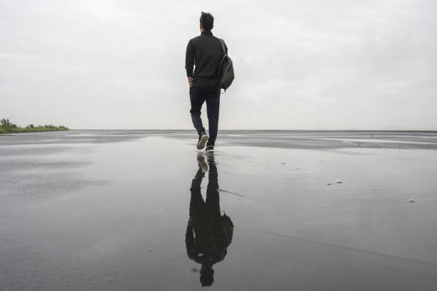 young male athlete taking a walk after a morning rain.