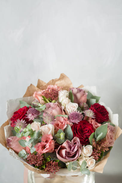 istock Flower composition on a gray background. Wedding and Festive decor. Bouquet from spring flowers. copy space 863481744