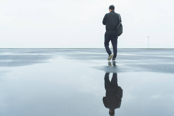 istock young male athlete taking a walk after a morning rain 863481912