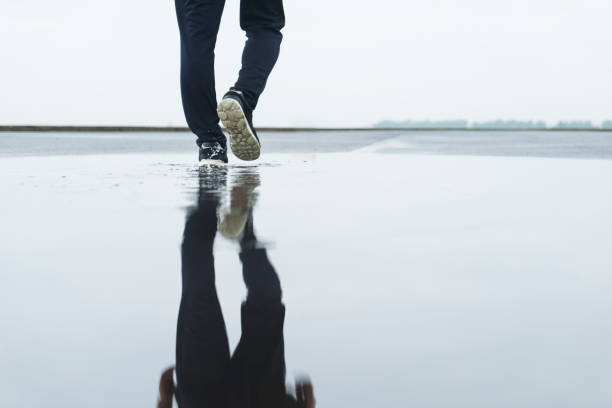 young male athlete taking a walk after a morning rain.